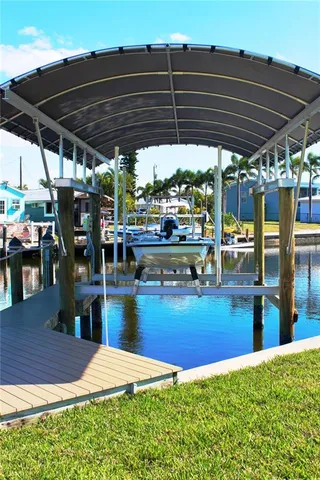 a kitchen with stainless steel appliances a stove a sink a microwave a refrigerator and cabinets