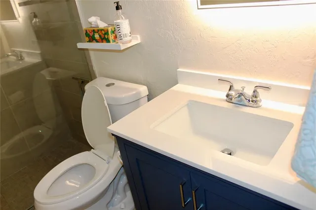 a view of a chairs and table in the patio