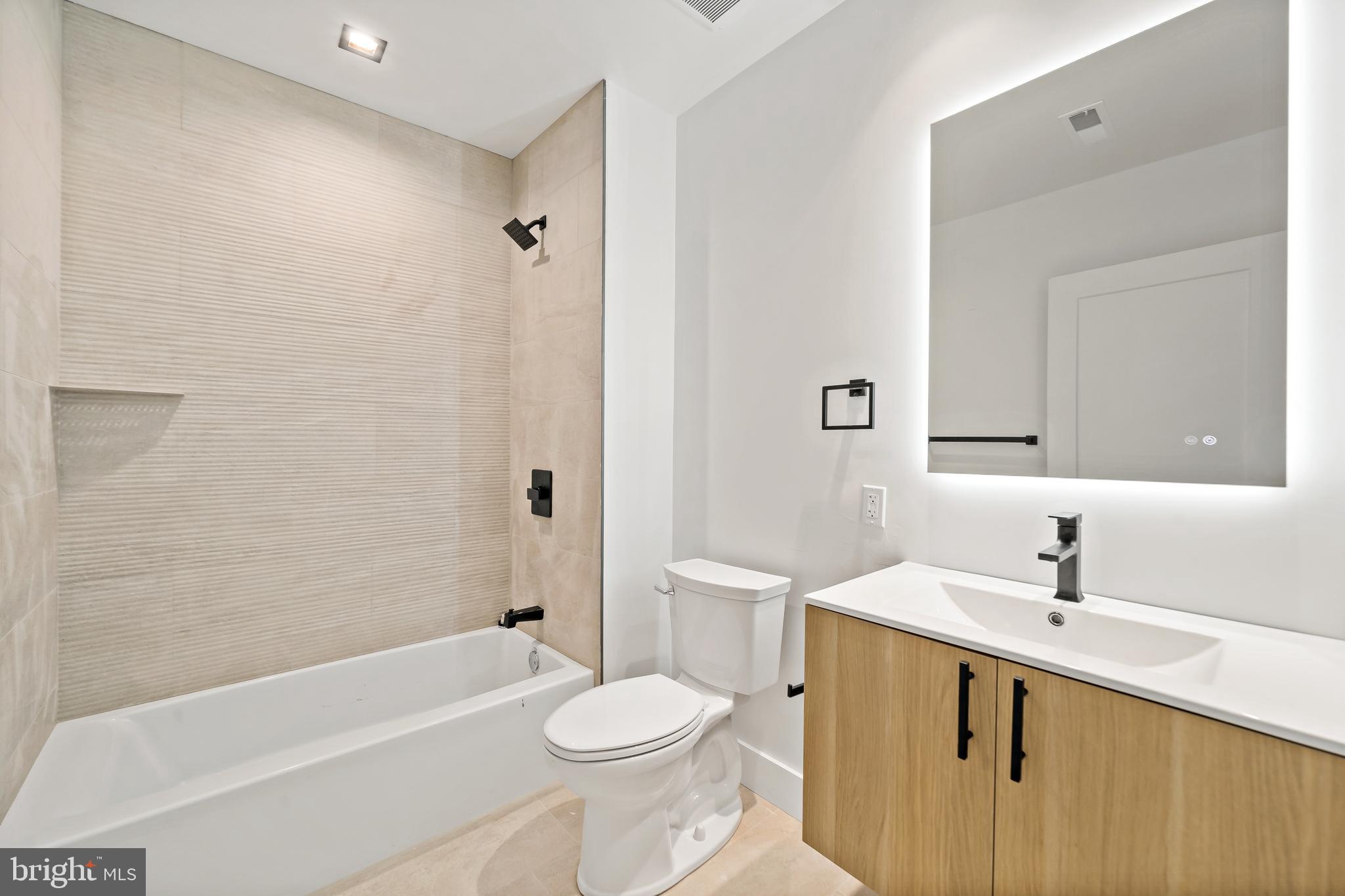 326 North 12th Street, Unit 506 Philadelphia, PA 19107 - Photo 16 of 22 a bathroom with a sink a toilet and shower