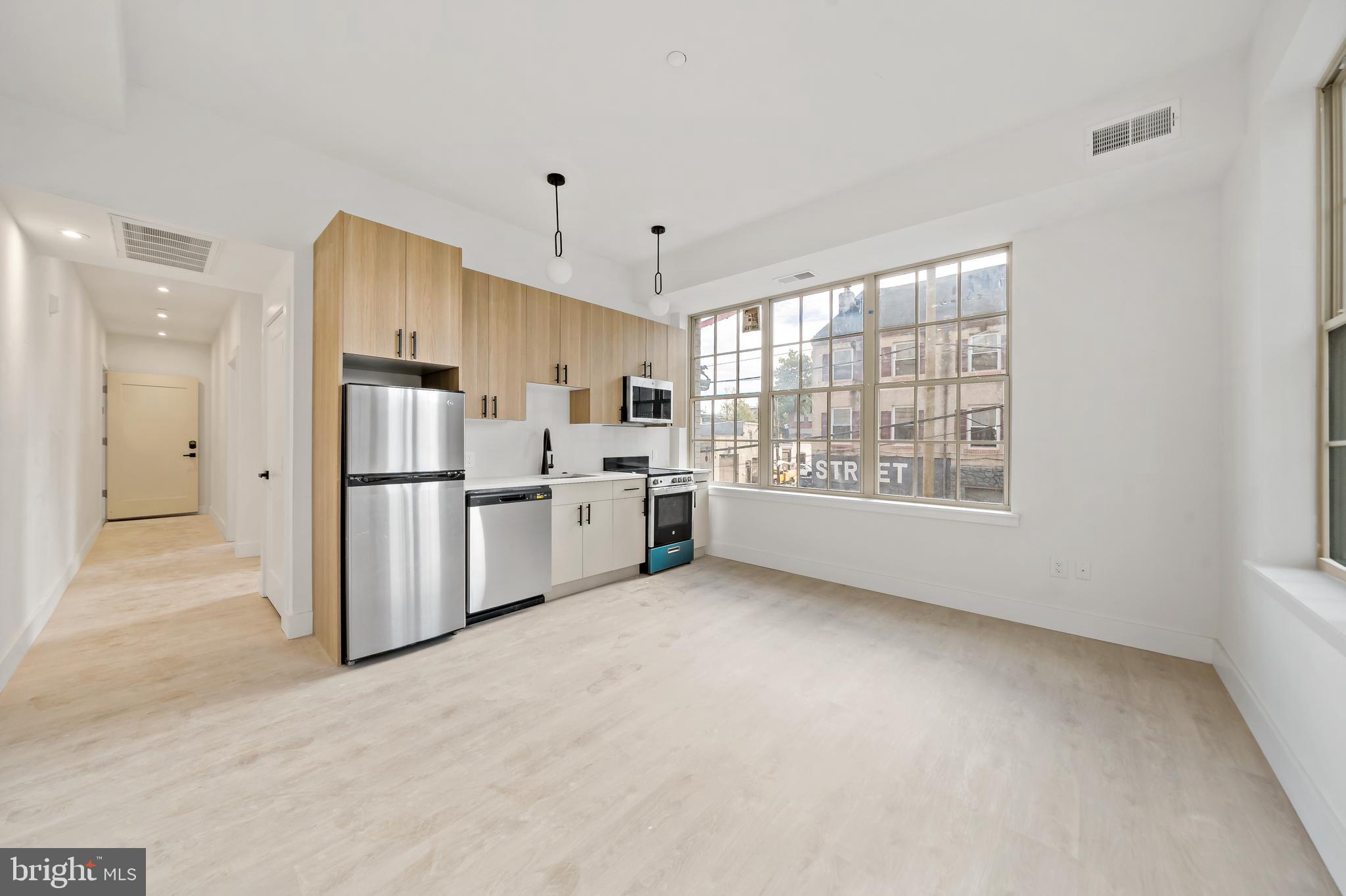 326 North 12th Street, Unit 506 Philadelphia, PA 19107 - Photo 22 of 22 a view of kitchen with stainless steel appliances refrigerator oven and cabinets