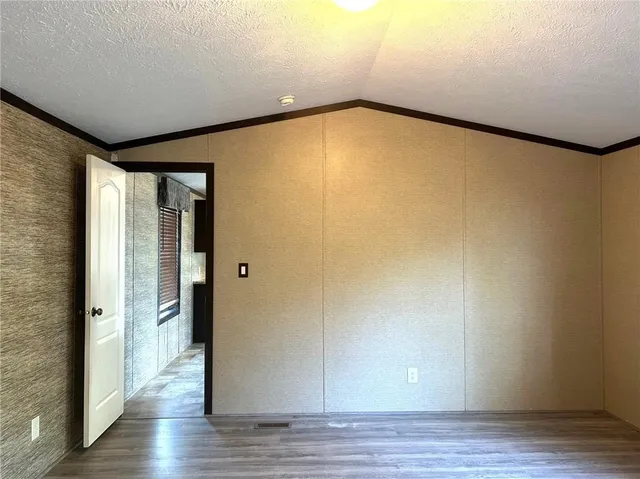 a bathroom with a granite countertop sink and mirror
