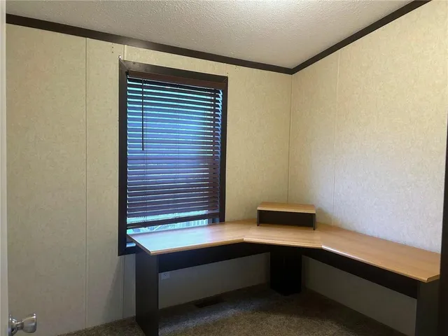 a view of a livingroom from a hallway