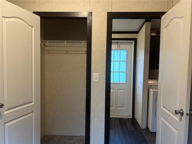 a bathroom with a granite countertop bathtub shower sink vanity and toilet