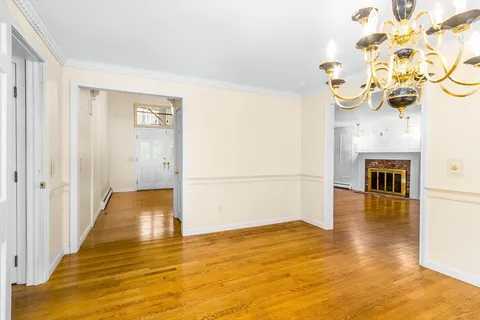 a view of a livingroom with wooden floor