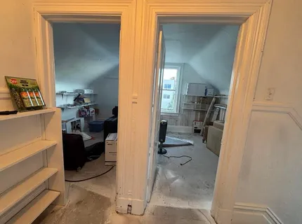 a view of a bedroom from a hallway