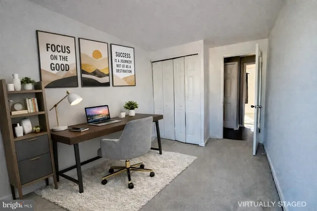 a view of a workspace with furniture