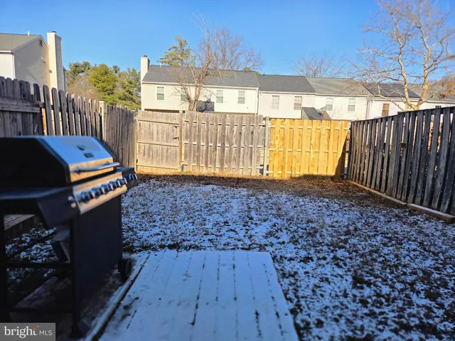 a backyard of a house with wooden floor