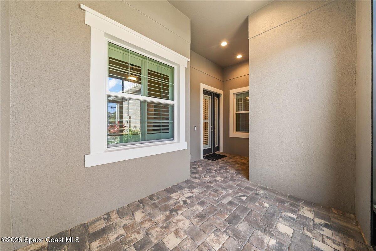 7980 Cache Crk Lane Melbourne, FL 32940 - Photo 9 of 47 Covered access