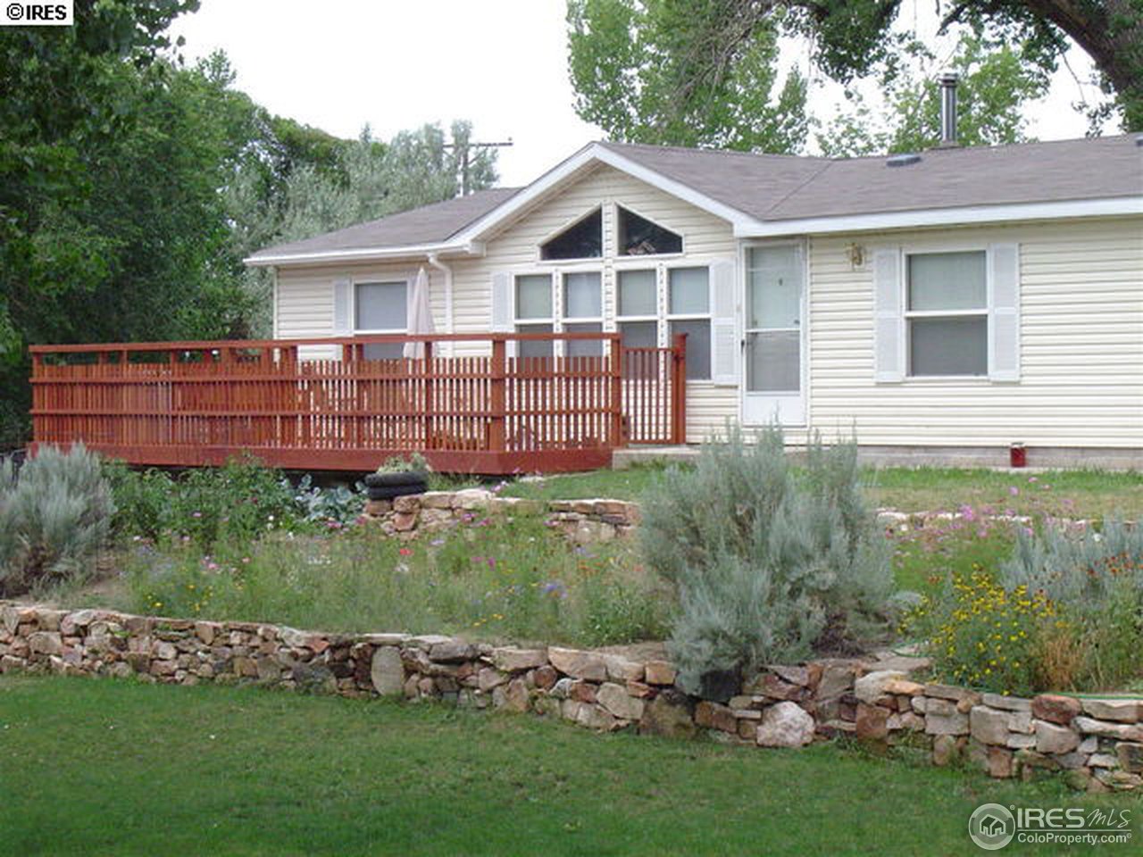 108 East Douglas Road Fort Collins, CO 80524 - Photo 2 of 12 a view of a house with a garden