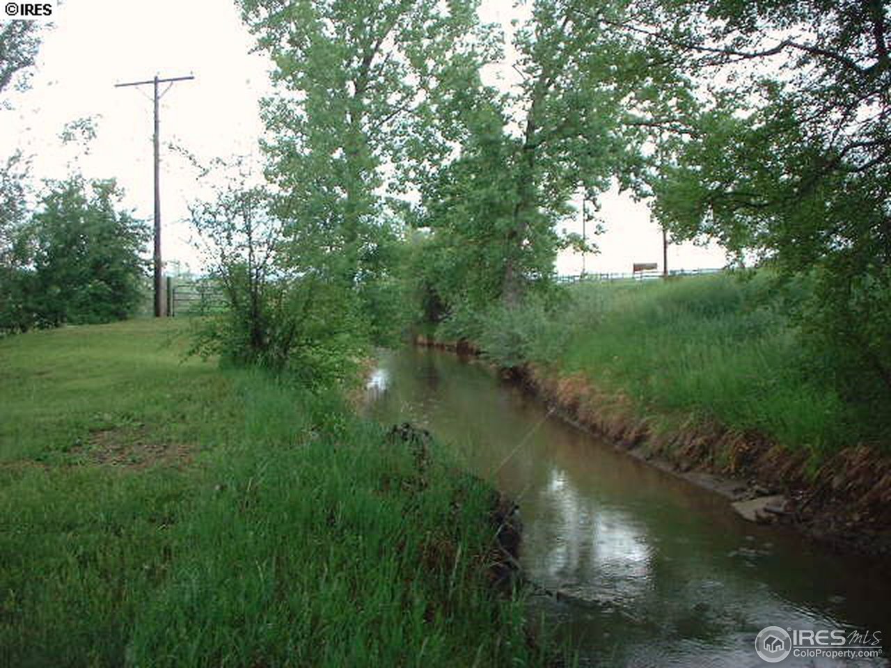 108 East Douglas Road Fort Collins, CO 80524 - Photo 10 of 12 a view of a lake with a yard