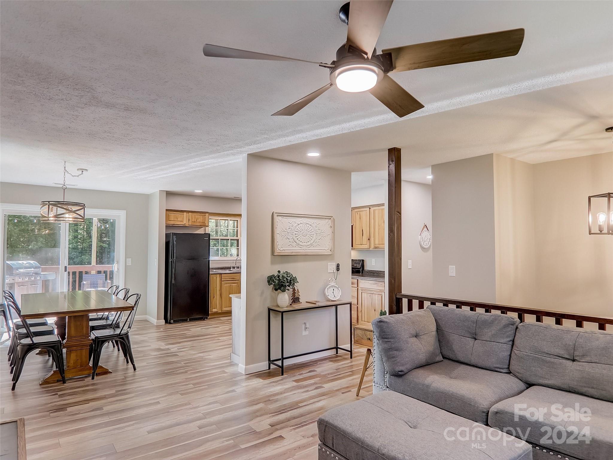 1191 Dupont Road Hendersonville, NC 28739 - Photo 13 of 48 a living room with furniture and a wooden floor