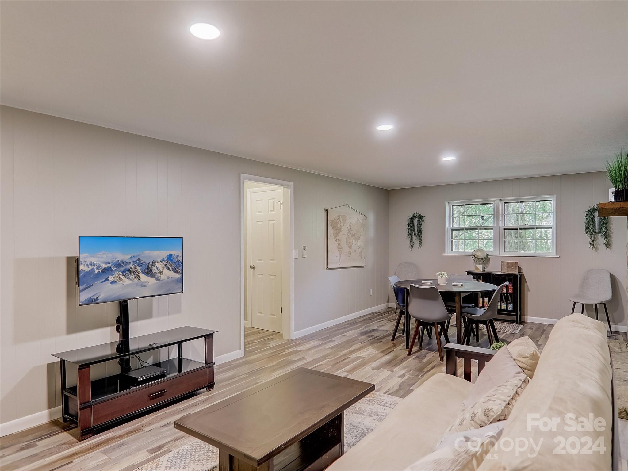 1191 Dupont Road Hendersonville, NC 28739 - Photo 21 of 48 a view of a livingroom with furniture and window