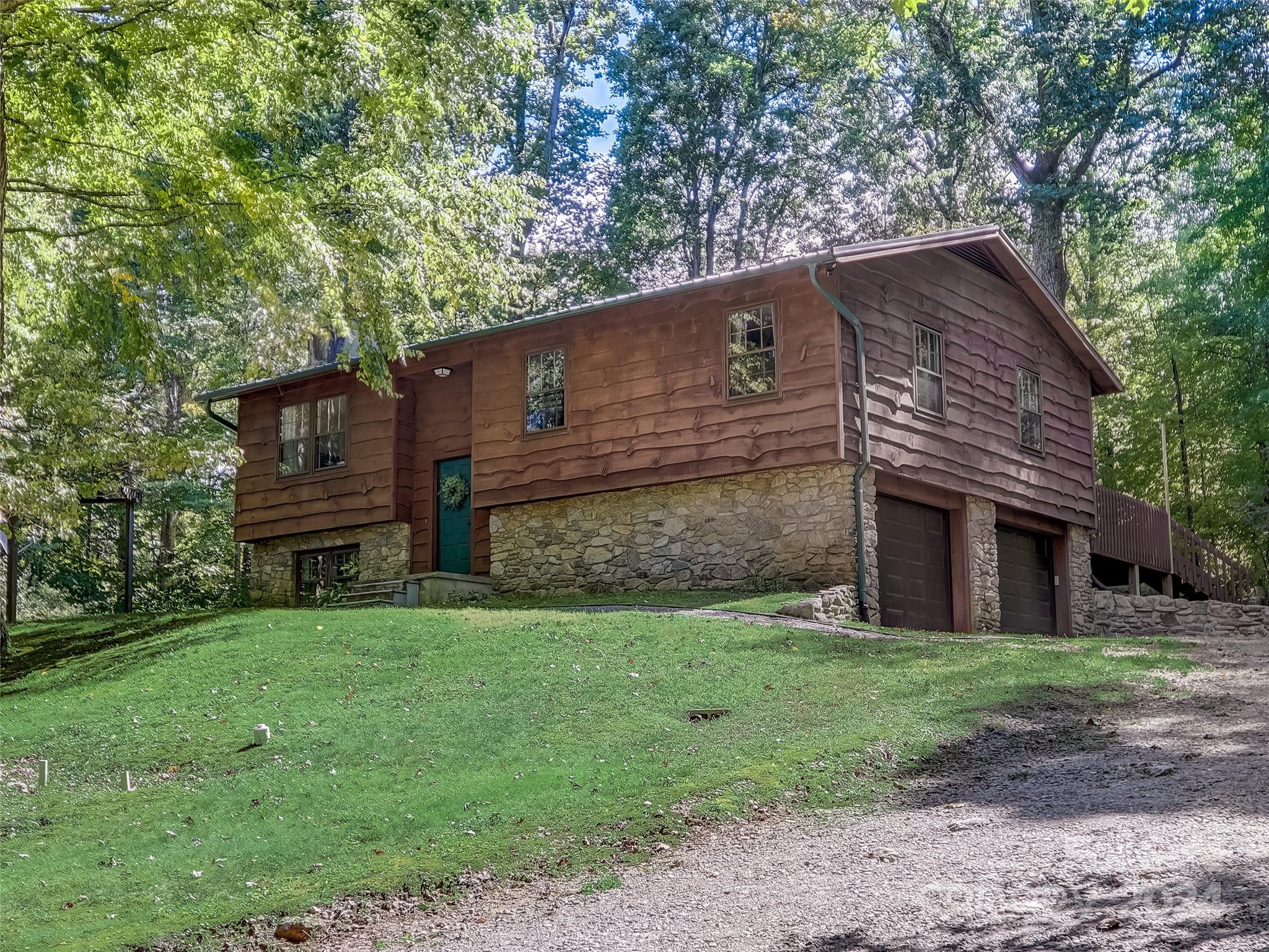 1191 Dupont Road Hendersonville, NC 28739 - Photo 3 of 48 a view of a house with a yard
