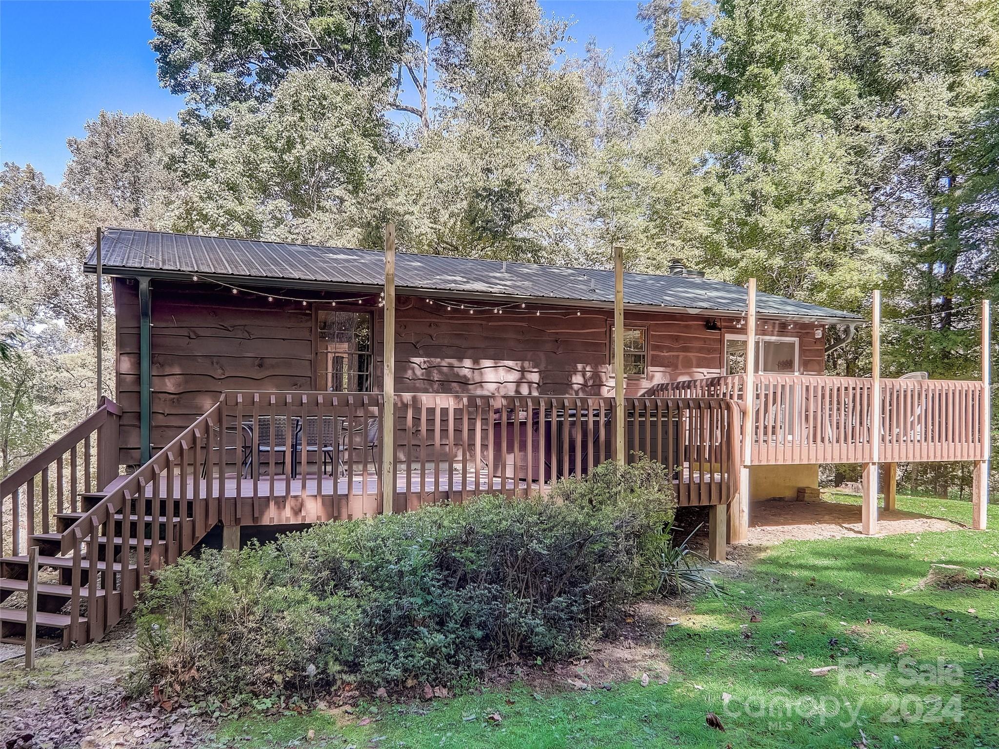 1191 Dupont Road Hendersonville, NC 28739 - Photo 32 of 48 a view of a backyard with garden