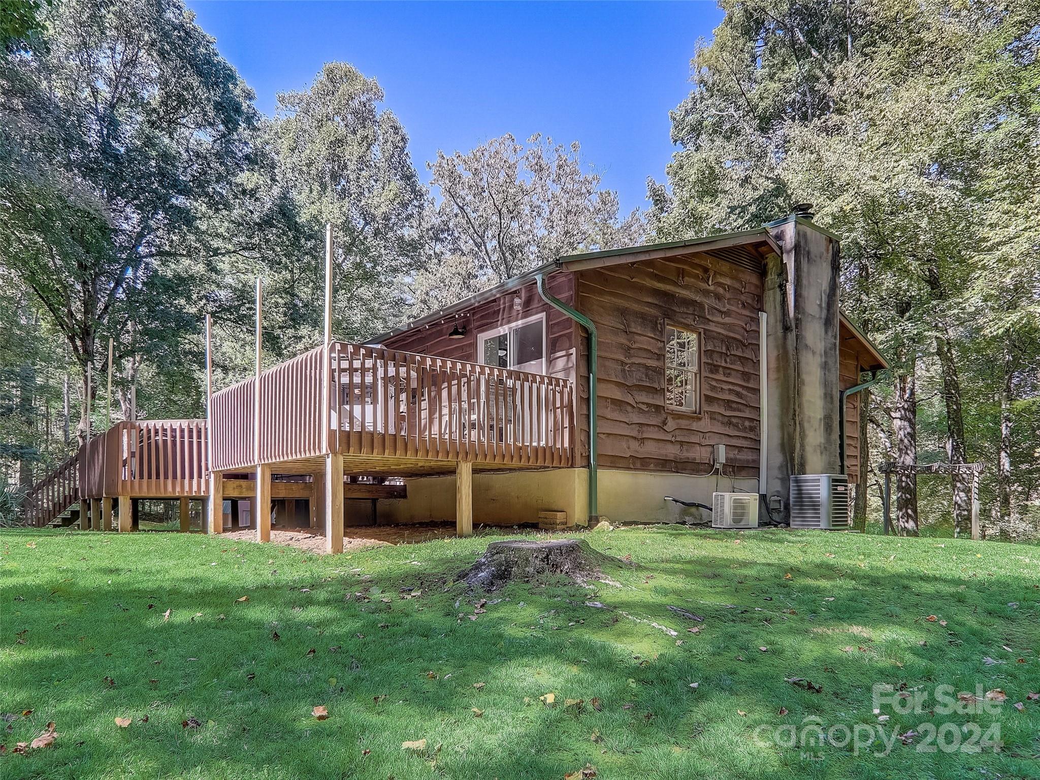 1191 Dupont Road Hendersonville, NC 28739 - Photo 33 of 48 a view of an house with backyard space and balcony