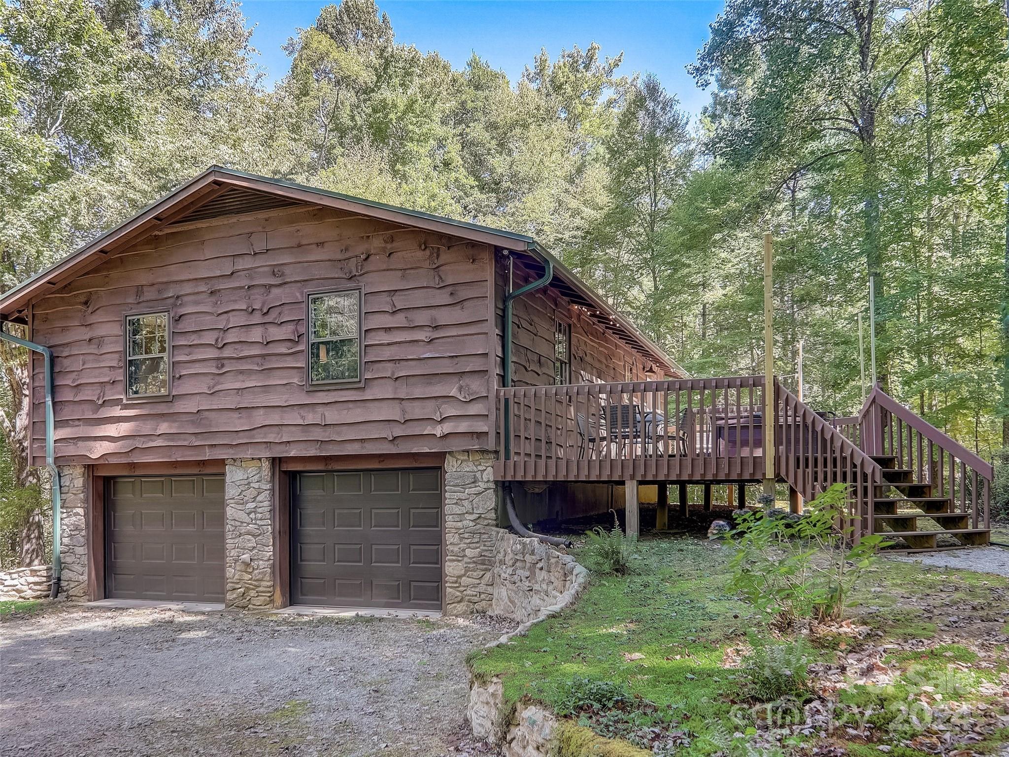 1191 Dupont Road Hendersonville, NC 28739 - Photo 35 of 48 a view of a house with a yard and large tree