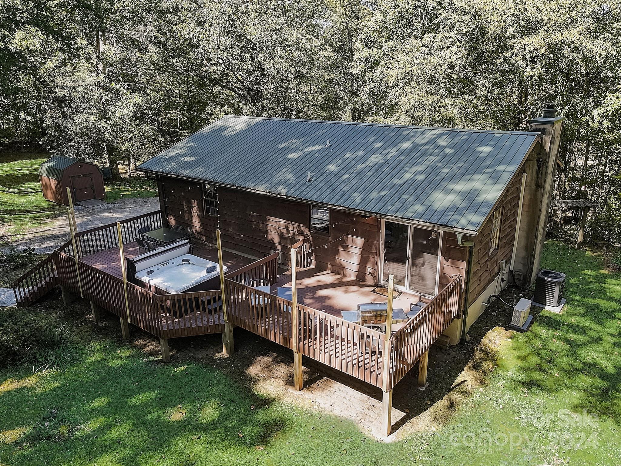 1191 Dupont Road Hendersonville, NC 28739 - Photo 48 of 48 a view of a house with backyard and sitting area