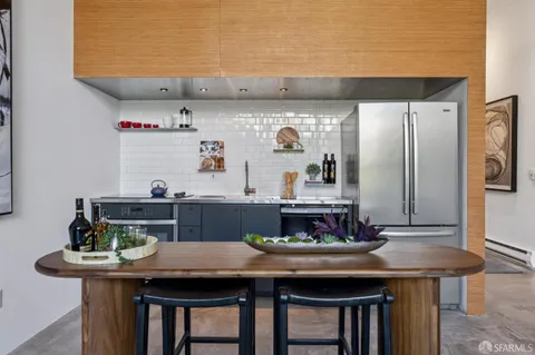 a kitchen with a table and chairs in it