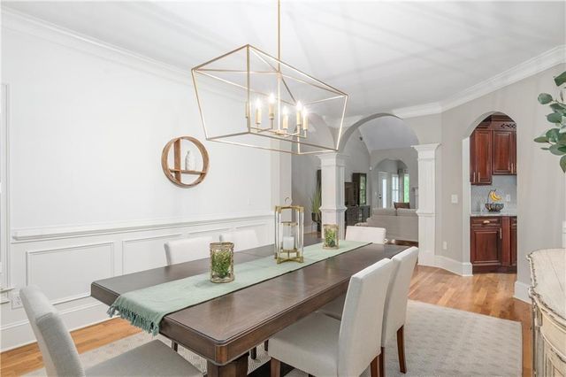 a kitchen with stainless steel appliances granite countertop wooden cabinets a stove top oven a sink and dishwasher