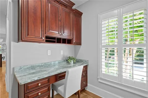 a living room with fireplace furniture and a wooden floor