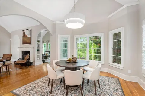 a spacious bedroom with a bed and a chandelier