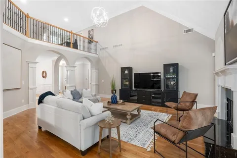 a spacious bedroom with a bed and a dresser