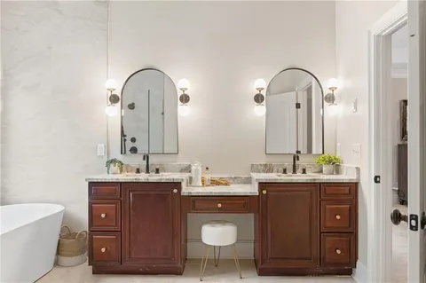 a bathroom with a sink toilet vanity and shower