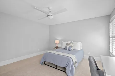 a room with furniture pool table and windows
