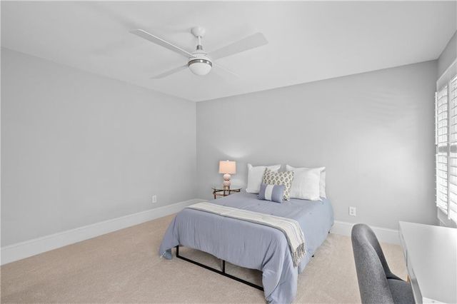 a room with furniture pool table and windows