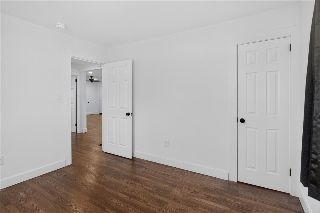 115 Pelfrey Street Seneca, SC 29672 - Photo 18 of 46 Rich hardwood flooring extends throughout this versatile interior space, connecting rooms seamlessly.
