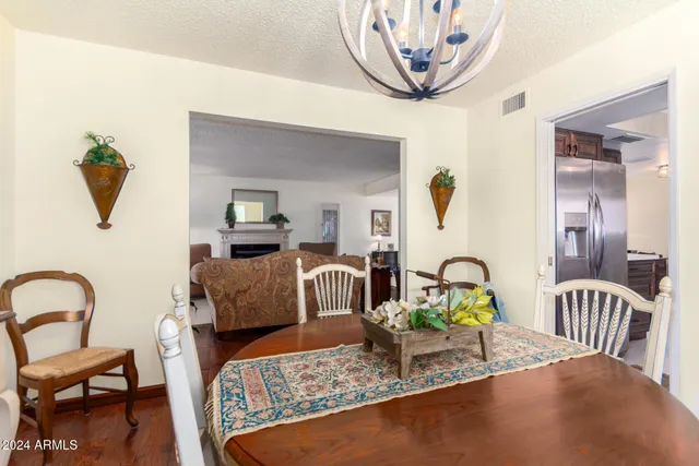 a living room with furniture and a dining table
