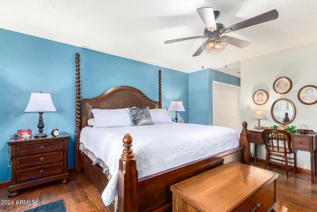 a bedroom with a bed and a chandelier