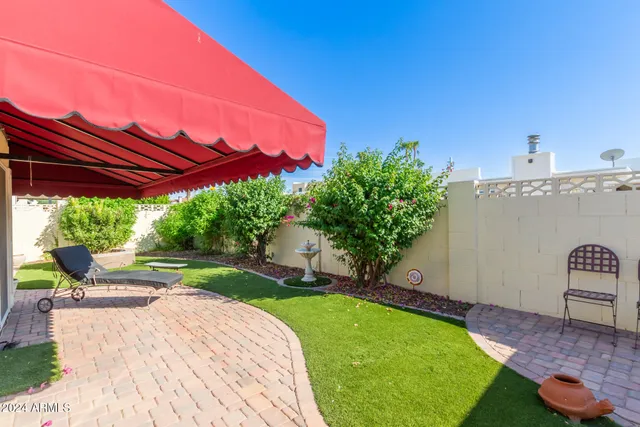 a view of a backyard with a garden and plants