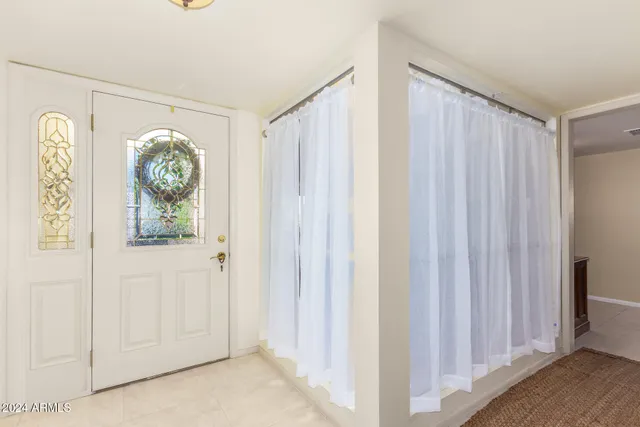 a view of entryway with wooden floor