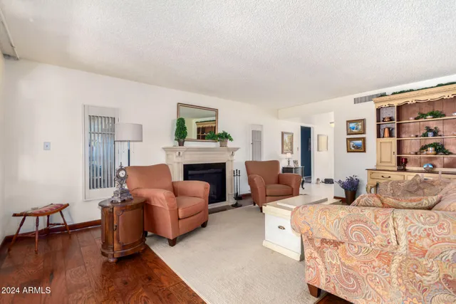 a bedroom with furniture and a fireplace