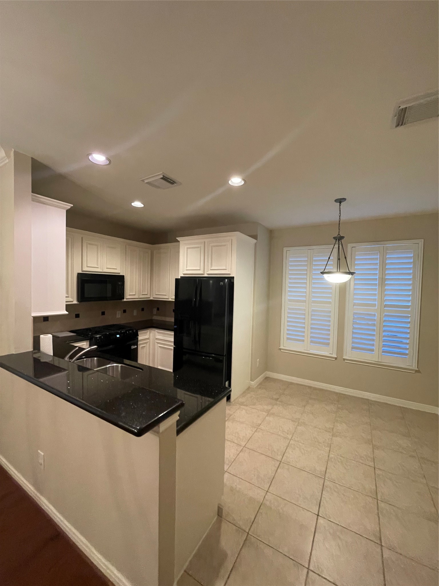 1040 La Rue Street Houston, TX 77019 - Photo 21 of 29 a kitchen with stainless steel appliances granite countertop a refrigerator a sink a stove a microwave and a counter top