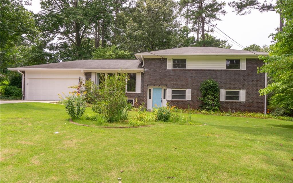 1163 Berkeley Road Avondale Estates, GA 30002 - Photo 1 of 1 a front view of house with yard and green space