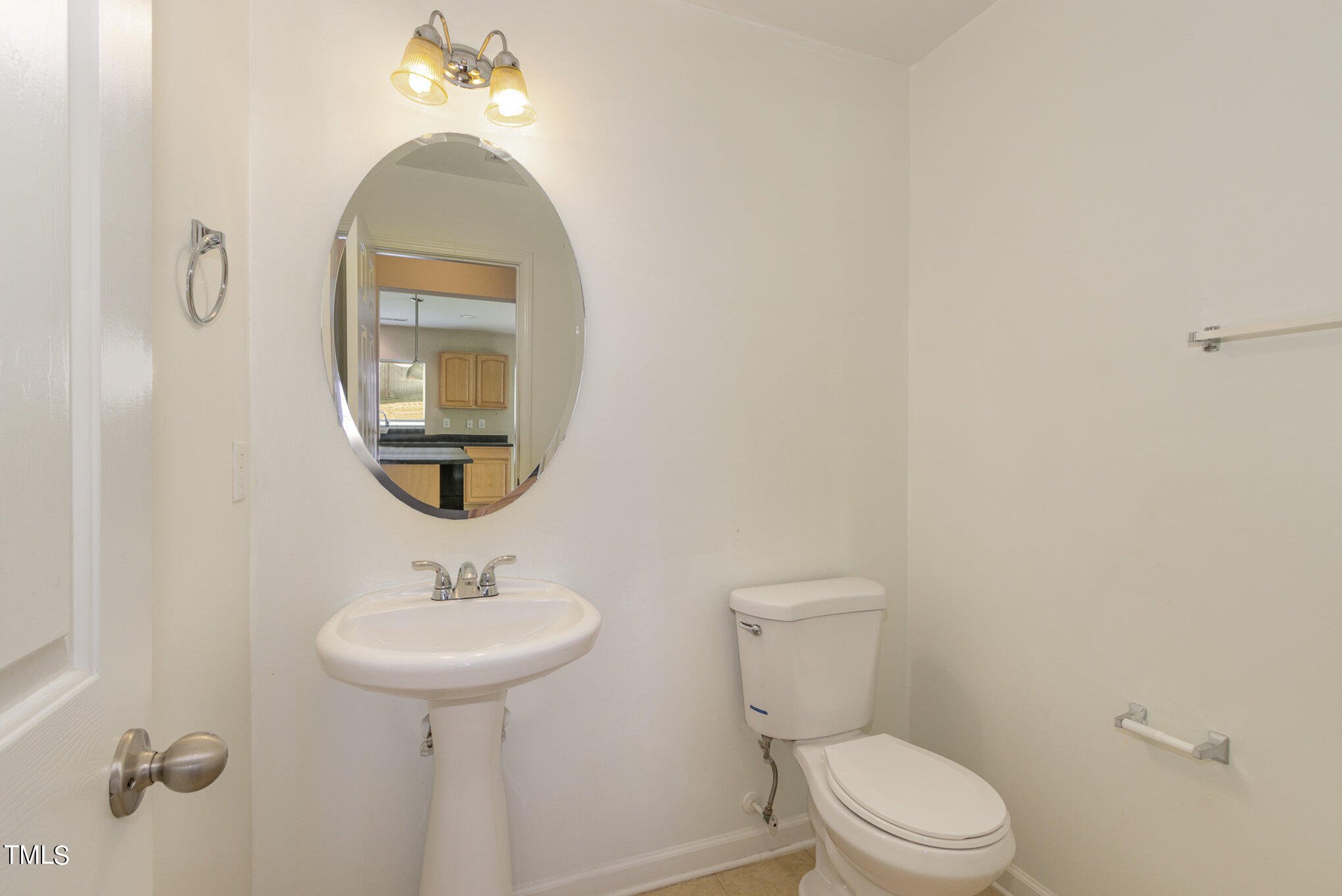 650 Conover Road Durham, NC 27703 - Photo 12 of 25 a bathroom with a toilet sink and mirror