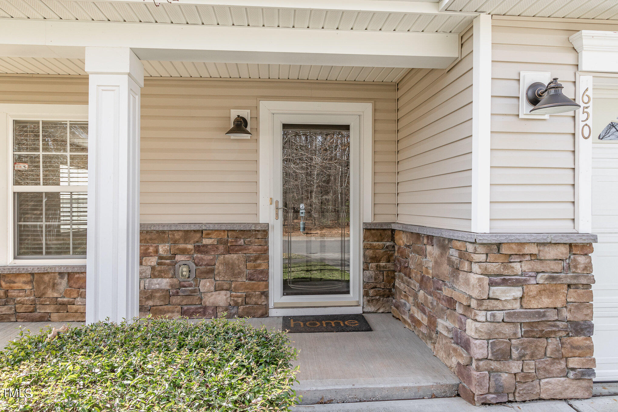 650 Conover Road Durham, NC 27703 - Photo 5 of 25 a front view of a house with a yard