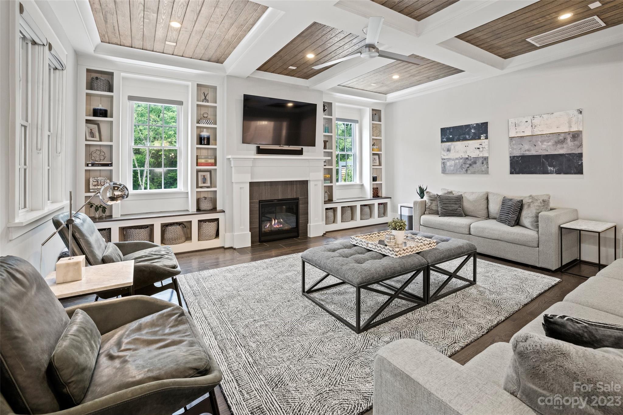 5524 Closeburn Road Charlotte, NC 28210 - Photo 11 of 44 a living room with furniture fireplace and a flat screen tv