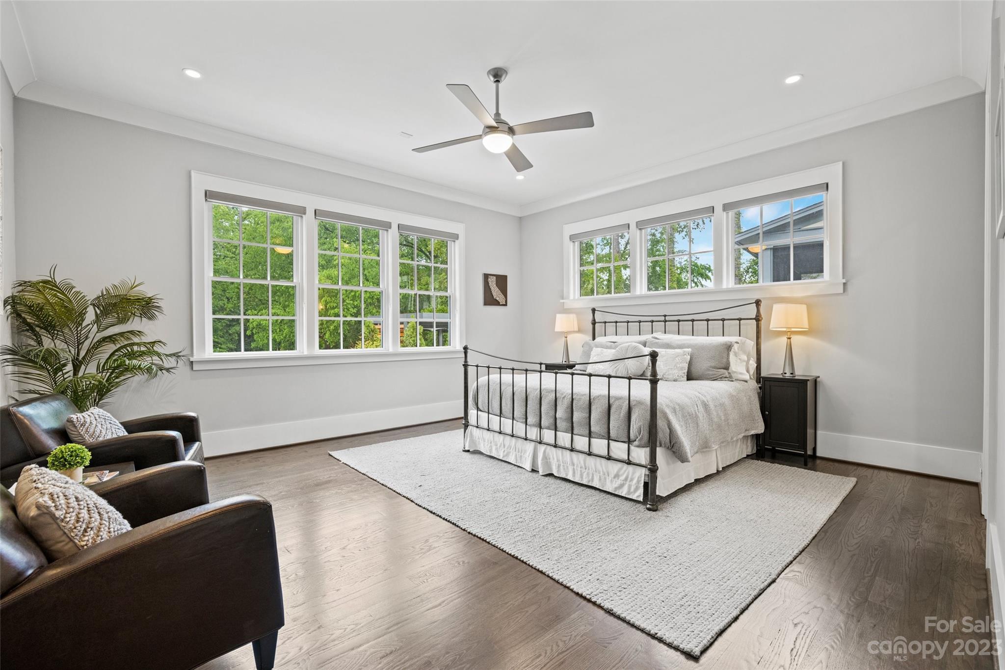 5524 Closeburn Road Charlotte, NC 28210 - Photo 13 of 44 a spacious bedroom with a bed a couch and a window