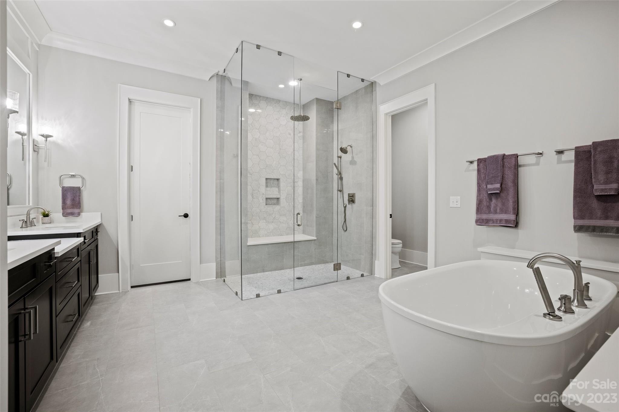 5524 Closeburn Road Charlotte, NC 28210 - Photo 15 of 44 a bathroom with a tub sink a toilet and shower