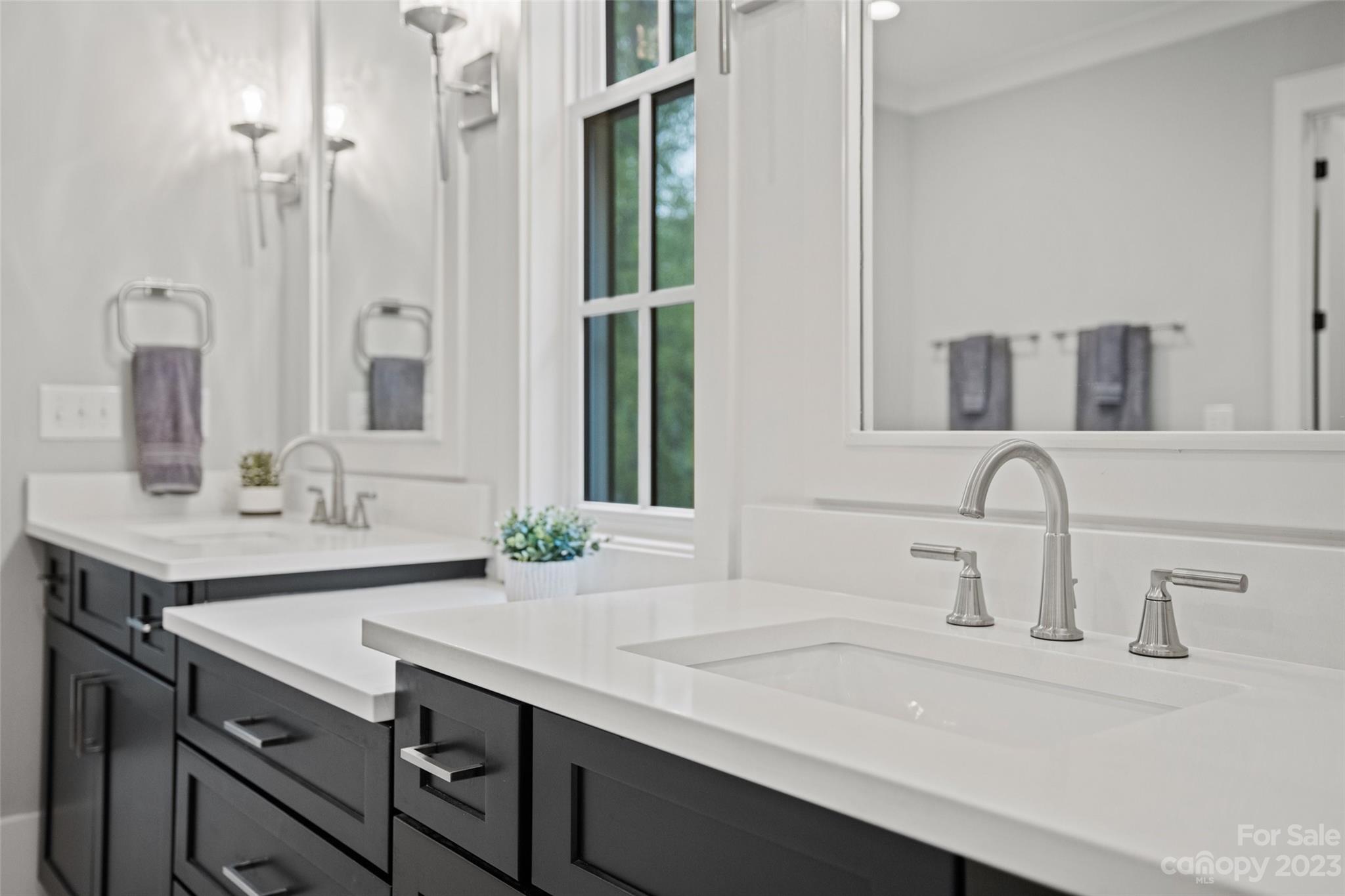 5524 Closeburn Road Charlotte, NC 28210 - Photo 16 of 44 a bathroom with a sink and a mirror