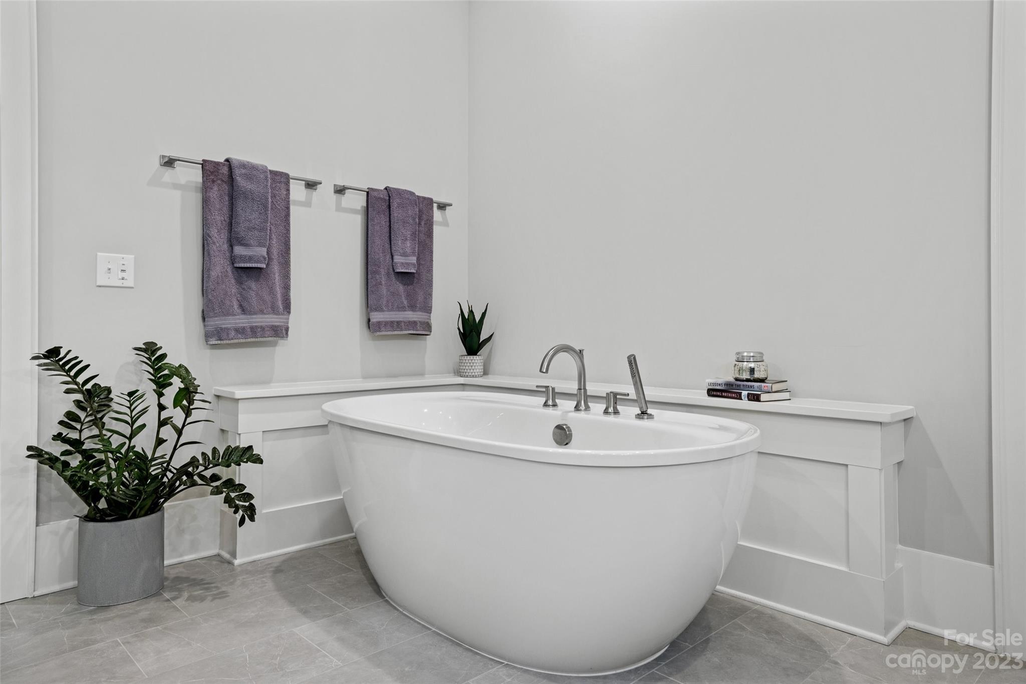 5524 Closeburn Road Charlotte, NC 28210 - Photo 17 of 44 a white bath tub sitting next to a white sink