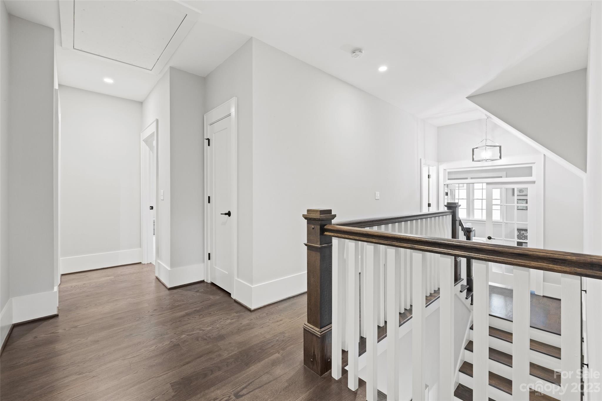 5524 Closeburn Road Charlotte, NC 28210 - Photo 28 of 44 a view of a hallway with wooden floor and staircase