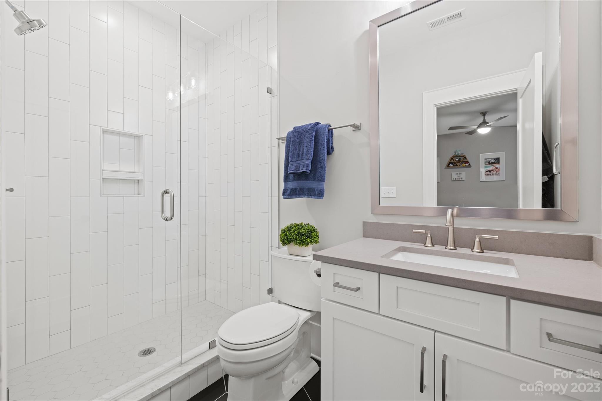 5524 Closeburn Road Charlotte, NC 28210 - Photo 34 of 44 a bathroom with a sink a toilet and shower