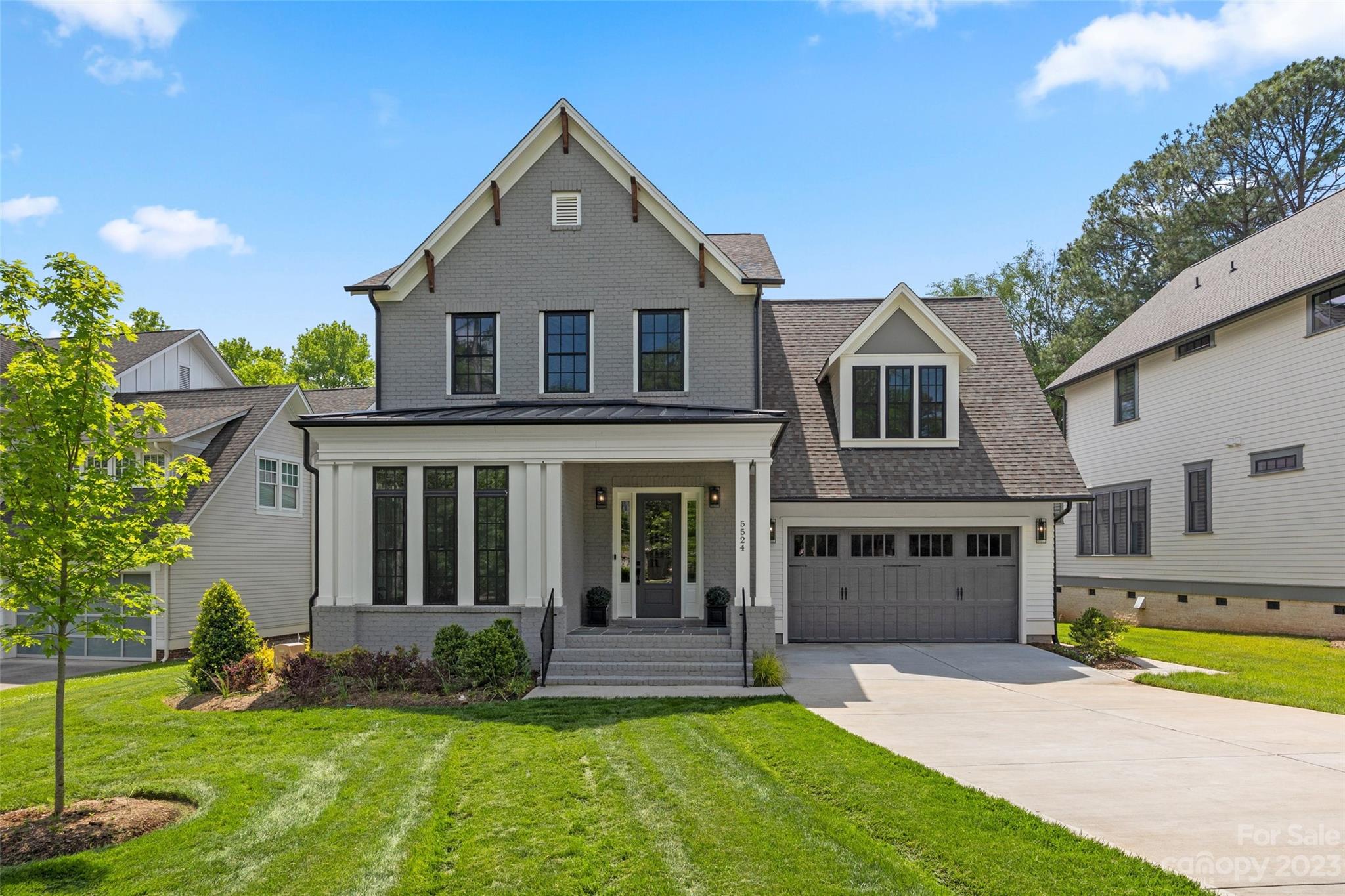 5524 Closeburn Road Charlotte, NC 28210 - Photo 44 of 44 a view of a yard in front of a brick house with a large windows