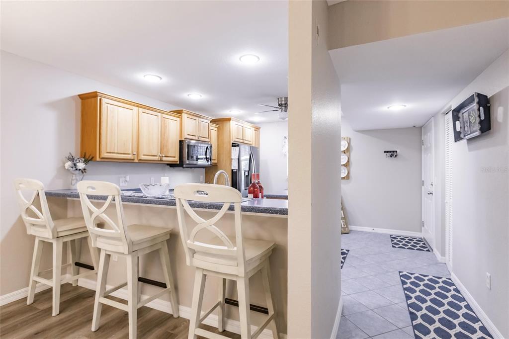 175 Kings Highway, Unit 538 Punta Gorda, FL 33983 - Photo 11 of 46 a view of a kitchen with kitchen island granite countertop appliances cabinets and a sink