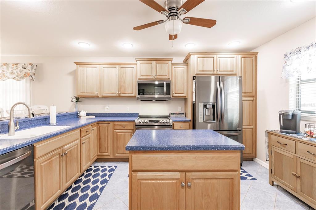 175 Kings Highway, Unit 538 Punta Gorda, FL 33983 - Photo 16 of 46 a kitchen with stainless steel appliances a sink stove and refrigerator