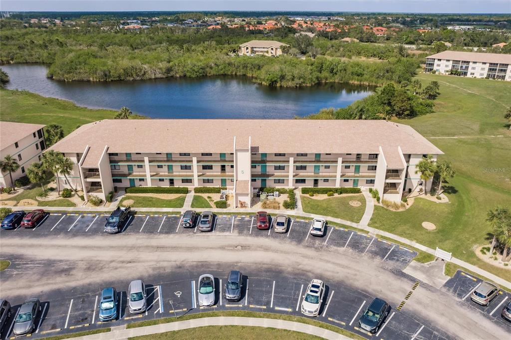 175 Kings Highway, Unit 538 Punta Gorda, FL 33983 - Photo 2 of 46 an aerial view of a house with a lake view